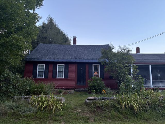 Shingle roof on a red home