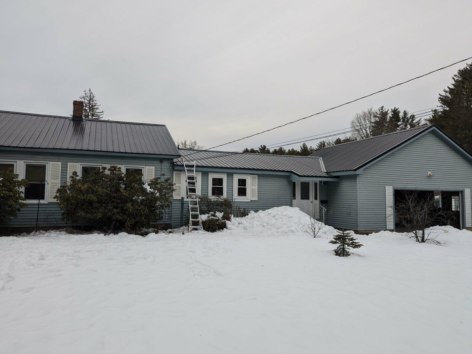 Metal roofing on a home and garage